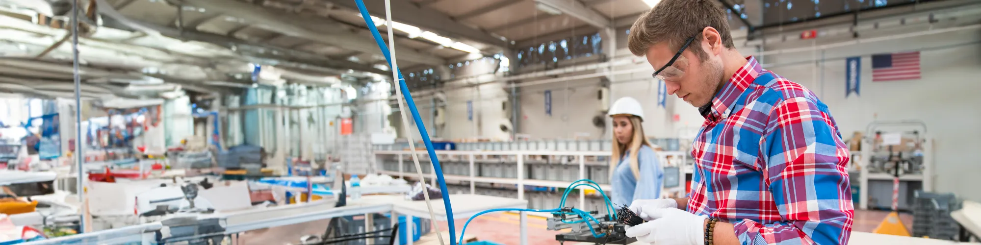 two people working in manufacturing plant